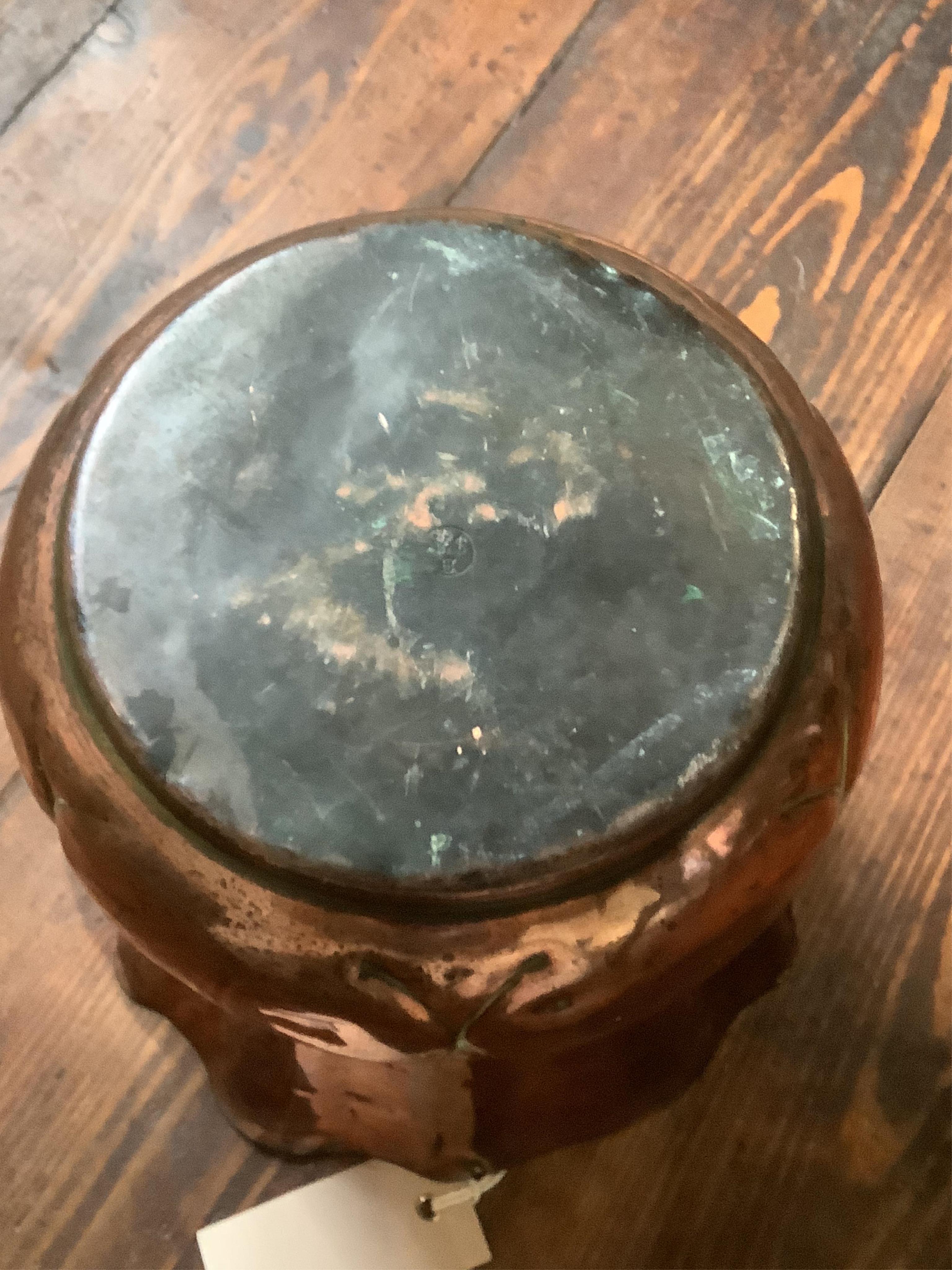A Wlliam Soutter & Sons Arts and Crafts embossed copper jardiniere, impressed mark to the base, 19cm high. Condition - some oxidised splash marks and minor dents